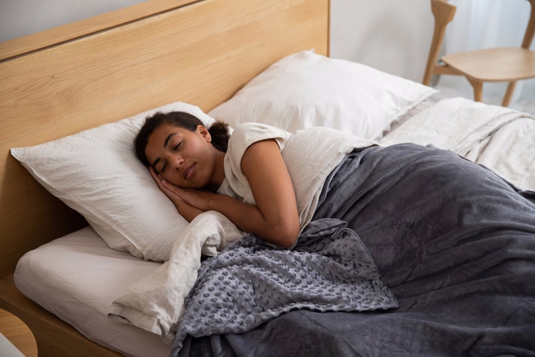 Woman sleeping peacefully in bed at night, representing GABA supplements and sleep support