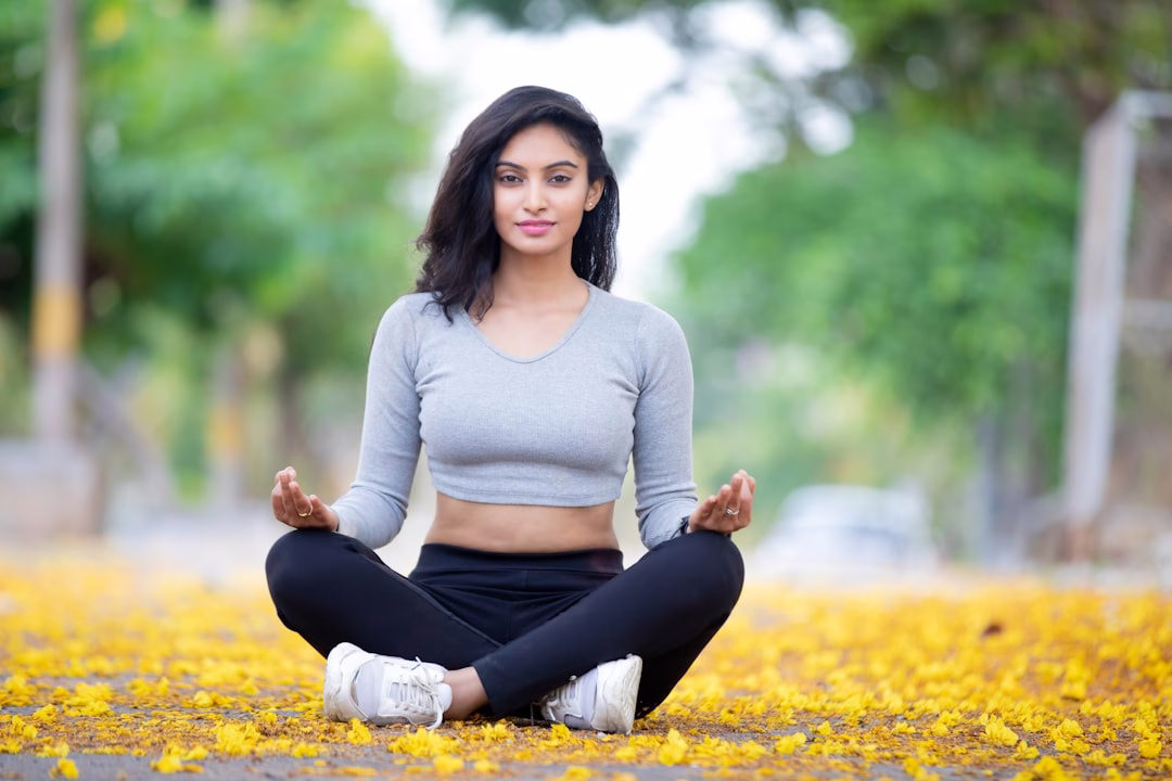 Woman practicing gentle yoga for ulcerative colitis stress management