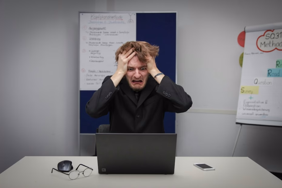 man grabbing head out of stress, looking for stress relief tips