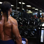 fit male exercising in gym showcasing strong back muscles and strength training