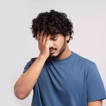 Stressed man showing signs of mental exhaustion and burnout