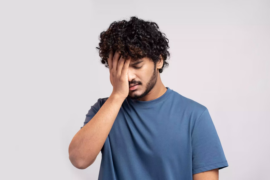 Stressed man showing signs of mental exhaustion and burnout