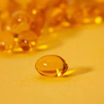 Vitamin D2 vs D3 comparison featuring orange softgel supplements